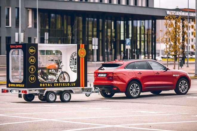 Dream Delivery! Royal Enfield Interceptor 650 packed in huge scale model box, towed by a Jaguar F-Pace