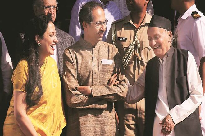 Maharashtra CM Uddhav Thackeray with his wife Rashmi Thackeray and Governor Bhagat Singh Koshyari at the Raj Bhavan. FILE. (Express photo by Nirmal Harindran)