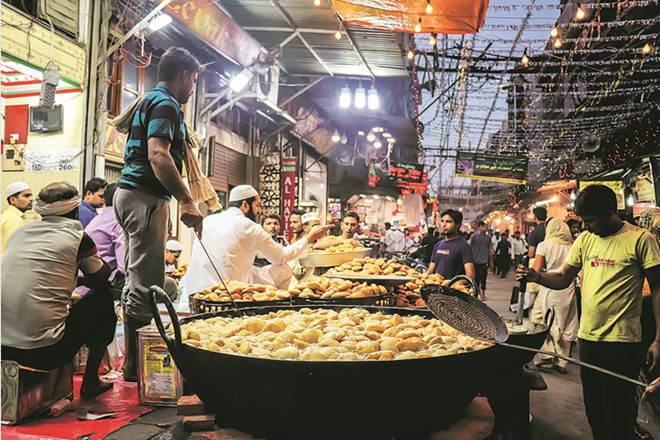 File photos of jam-packed markets and lavish food stalls during Eid celebrations in Old Delhi. 