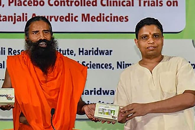 Baba Ramdev (centre) at the launch of the medicine kit to treat coronavirus. (PTI photo)