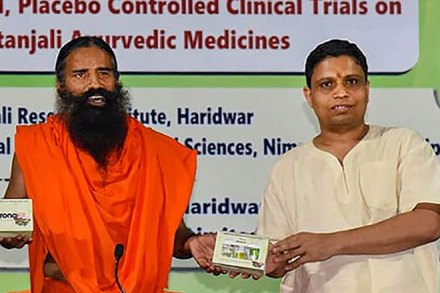 Baba Ramdev (centre) at the launch of the medicine kit to treat coronavirus. (PTI photo)
