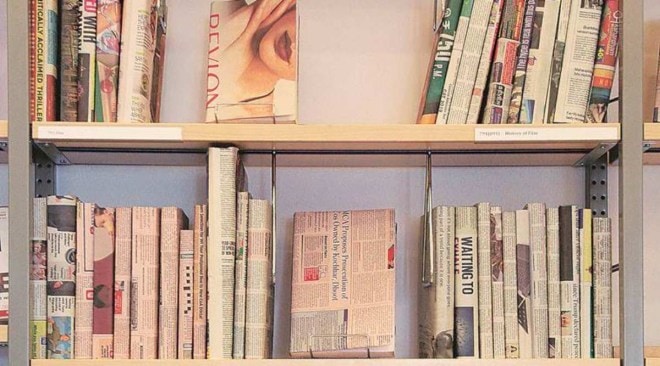 Books lie strewn on the ground in the aftermath of cyclone Amphan at College Street, Kolkata