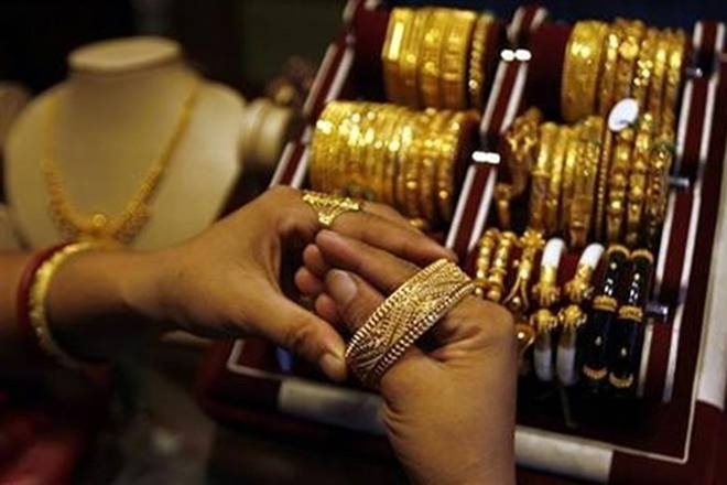 Gold prices fall after touching all-time high in previous session; should you buy or sell the yellow metal Gold prices fall after touching all-time high in previous session; should you buy or sell the yellow metal