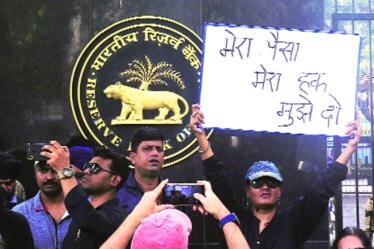 A file photo of a protest by PMC Bank account holders outside the RBI office in Mumbai (Express Photo)
