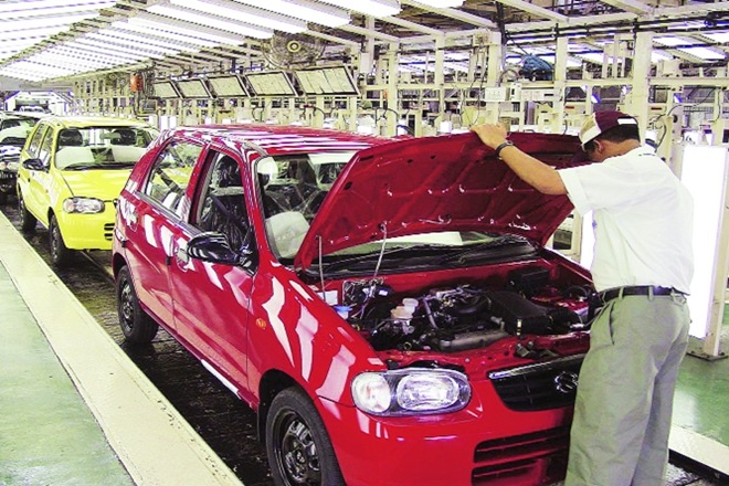A file photo of a technician working on a car at the Maruti factory in Gurugram (Bloomberg)