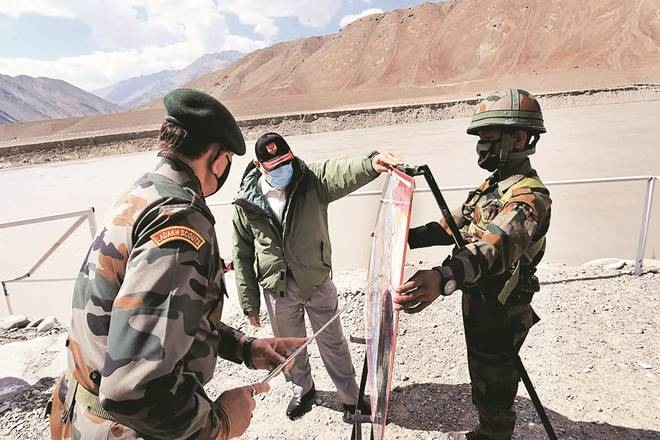 In this photo provided by the Press Information Bureau, Indian Prime Minister Narendra Modi interacts with soldiers during a visit to the Ladakh area, India, Friday, July 3, 2020. Modi made an unannounced visit Friday to a military base in remote Ladakh region bordering China where the soldiers of the two countries have been facing off for nearly two months. Modi’s visit comes in the backdrop of massive Indian army build-up in Ladakh region following hand-to-hand combat between Indian and Chinese soldiers on June 15 that left 20 Indian soldiers dead and dozens injured, the worst military confrontation in over four decades between the Asian giants. (Press Information Bureau via AP) In this photo provided by the Press Information Bureau, Indian Prime Minister Narendra Modi interacts with soldiers during a visit to the Ladakh area, India, Friday, July 3, 2020. Modi made an unannounced visit Friday to a military base in remote Ladakh region bordering China where the soldiers of the two countries have been facing off for nearly two months. Modi’s visit comes in the backdrop of massive Indian army build-up in Ladakh region following hand-to-hand combat between Indian and Chinese soldiers on June 15 that left 20 Indian soldiers dead and dozens injured, the worst military confrontation in over four decades between the Asian giants. (Press Information Bureau via AP)