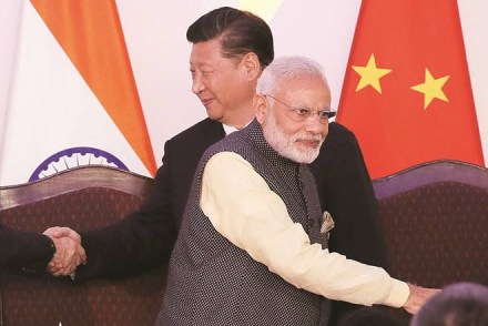 In this Oct. 16, 2016, file photo, Indian Prime Minister Narendra Modi, front and Chinese President Xi Jinping shake hands with leaders at the BRICS summit in Goa, India. Modi made an unannounced visit Friday, July 3, 2020, to a military base in remote Ladakh region bordering China where the soldiers of the two countries have been facing off for nearly two months. Modi’s visit comes in the backdrop of massive Indian army build-up in Ladakh region following hand-to-hand combat between Indian and Chinese soldiers on June 15 that left 20 Indian soldiers dead and dozens injured, the worst military confrontation in over four decades between the Asian giants. (AP Photo/Manish Swarup, File)