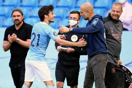 Manchester City's David Silva gets a hug from Manchester City's head coach Pep Guardiola as he leaves the pitch at the end of the English Premier League soccer match between Manchester City and Norwich City at the Etihad Stadium in Manchester, England, Sunday, July 26, 2020. (Peter Powelll/Pool via AP) Manchester City's David Silva gets a hug from Manchester City's head coach Pep Guardiola as he leaves the pitch at the end of the English Premier League soccer match between Manchester City and Norwich City at the Etihad Stadium in Manchester, England, Sunday, July 26, 2020. (Peter Powelll/Pool via AP)