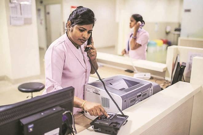 A nurse makes a phone call from a counter in an intensive care unit (ICU) at an Apollo Speciality Hospital, operated by Apollo Hospitals Enterprises Ltd., in the Vanagaram area of Chennai, India, on Saturday, Nov. 17, 2018. About a decade ago, Co-Managing Director Suneeta Reddy and her three sisters took over most executive functions at India's largest hospital chain from their father. They embarked on a multi-year building spree in a bet that India's economic growth would spread from its metropolises to second-tier cities, where patients are getting richer. Now, almost 20 billion rupees (0 million) and four years of construction later, there are signs that strategy is about to pay off. Photographer: Dhiraj Singh/Bloomberg