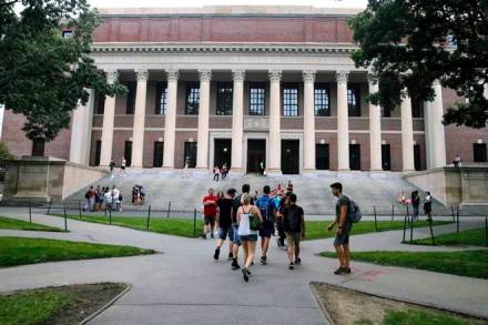 FILE - In this Aug. 13, 2019 file photo, students walk near the Widener Library in Harvard Yard at Harvard University in Cambridge, Mass. The Ivy League school announced Monday, July 6, 2020, that as the coronavirus pandemic continues its freshman class will be invited to live on campus this fall, while most other undergraduates will be required learn remotely from home. (AP Photo/Charles Krupa, File) FILE - In this Aug. 13, 2019 file photo, students walk near the Widener Library in Harvard Yard at Harvard University in Cambridge, Mass. The Ivy League school announced Monday, July 6, 2020, that as the coronavirus pandemic continues its freshman class will be invited to live on campus this fall, while most other undergraduates will be required learn remotely from home. (AP Photo/Charles Krupa, File)