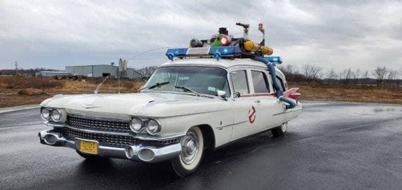 The Ectomobile is a 1959 Cadillac recreated rather brilliantly to look like the iconic movie car. The doors have the Ghostbusters emblem and there's equipment on the roof but it does have peeling paint and a cracked window. (Photo: Skipco Auto Auction)