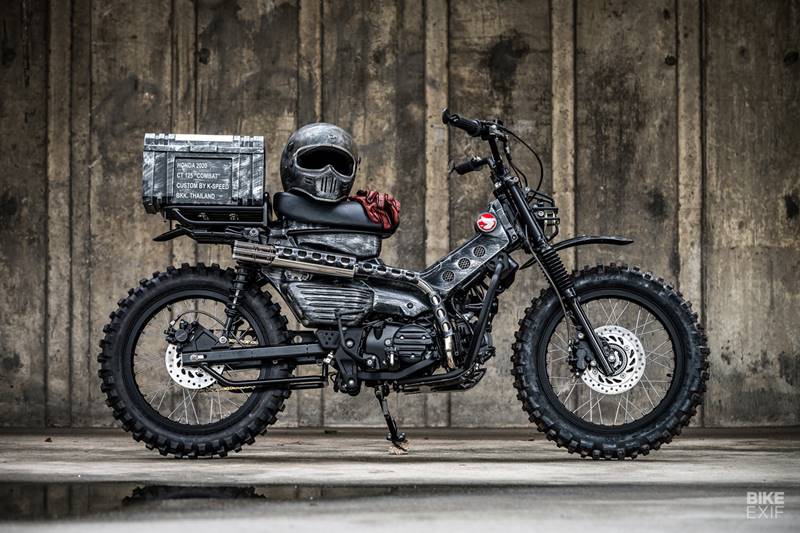 With 'combat' as its theme, the CT125 was given a new 2" longer custom-built swing arm making space for 100/100-17 enduro tyre at the rear. The OEM mudguard was replaced with a slim one on a new rack to also support a 'tool box'. They gave it Diablo (K-Speed in-house brand) shocks lifting it by 1.5". (Source: Bikeexif) <strong>You may also like: </strong><a href="https://www.financialexpress.com/auto/gallery/american-chopper-honda-cub-bike-modifications-modified-bikes-bike-customisation/photos/1921230/">American chopper-style makeover for this Honda Cub is the cute scoot you must see</a>