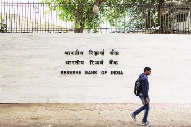 A pedestrian walks past the RBI building in Mumbai. Some of Acharya’s hard-hitting speeches provide a glimpse of the wide chasm between Mint Street and Delhi during his stint as deputy governor of RBI between January 2017 and July 2019 (Bloomberg image)