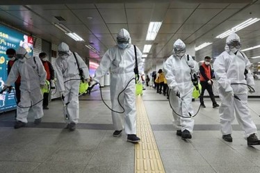 China's northwestern region of Xinjiang has 26 new cases as authorities continue to fight to curb an outbreak through travel restrictions and the lockdown of some residential areas.