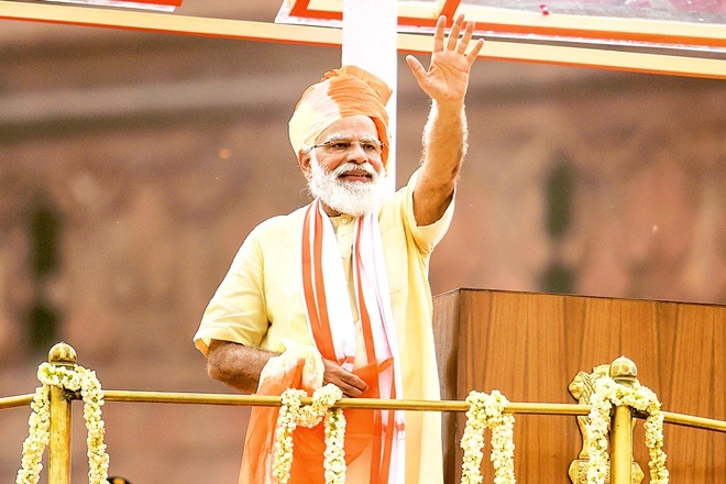 Prime Minister Narendra Modi waves to the crowd during the 74th Independence Day celebrations at Red Fort in New Delhi on Saturday (PTI Image) Prime Minister Narendra Modi waves to the crowd during the 74th Independence Day celebrations at Red Fort in New Delhi on Saturday (PTI Image)
