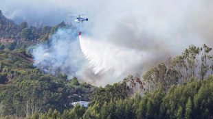 Overall, the fires have killed five people, torched nearly 700 homes and other structures.