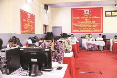 Civil defense members and counselors work at the Covid-19 district surveillance and telemedicine hub at a school in Newl Delhi, India, on Sunday, Aug. 2, 2020. India has the most confirmed cases after the U.S. and Brazil - and one of the world’s fastest growing epidemics, adding more than 50,000 cases each day. Photographer: T. Narayan/Bloomberg