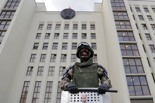 A member of Belarusian Interior Ministry troops stands guard during an opposition demonstration to protest against police violence and to reject the presidential election results near the Government House in Independence Square in Minsk, Belarus August 14, 2020. REUTERS/Vasily Fedosenko