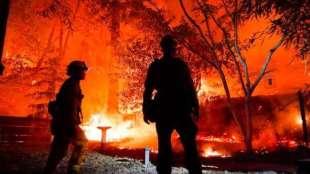 The fires have killed five people and torched nearly 700 homes.