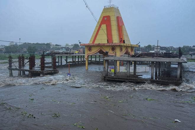 Rajkot: Ramnath Temple submerged in flood water of Aji River after heavy rain, in Rajkot, Tuesday, Aug. 18, 2020. (PTI Photo)(PTI18-08-2020_000130B)
