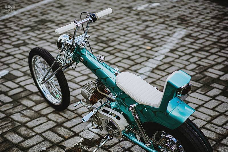 Braking is via a classic drum configuration and a custom-made white leather seat sits above. Even the taillight is hand crafted, made by a friend on the neighbouring island of Java. The paint job is particularly bagus, and was executed by another friend of the shop, Solin. (Source: BikeExif) <strong>Gallery: </strong><a href="https://www.financialexpress.com/auto/gallery/honda-cub-cute-scoot-american-chopper-design-engine-modified-bikes-bike-modification/photos/2007246/">Another Honda Cub cute scoot: After American chopper, quirky design & bigger engine for this Cub</a>