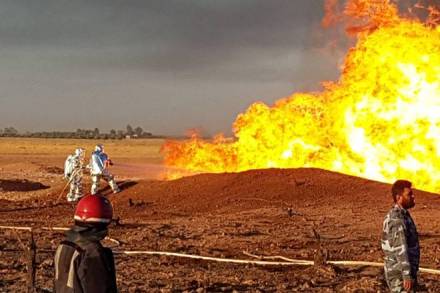 Firefighters spray water on the fire that resulted from an explosion on the Arab Gas Pipeline between the towns of Ad Dumayr and Adra, northwest of the capital of Damascus, Syria, in this handout released by SANA on August 24, 2020. SANA/Handout via REUTERS ATTENTION EDITORS - THIS IMAGE WAS PROVIDED BY A THIRD PARTY. REUTERS IS UNABLE TO INDEPENDENTLY VERIFY THIS IMAGE.