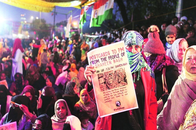 A file photo of protesters at Shaheen Bagh in New Delhi. They tried to reach out to those in power through songs, slogans, placards, graffiti and even postcards to the Prime Minister (Express photo)