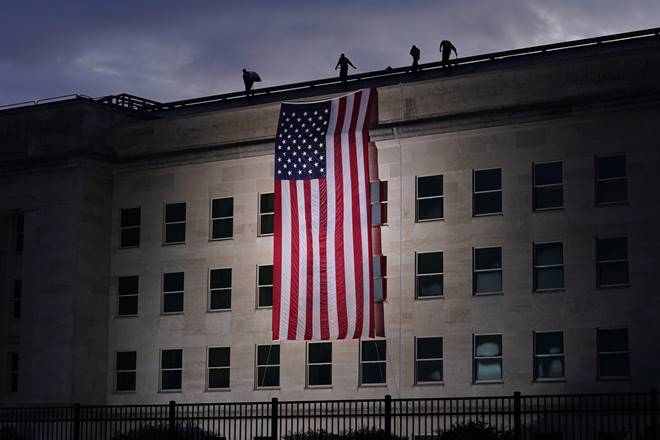 Washington: A large American flag is unfurled at the Pentagon ahead of ceremonies at the National 9/11 Pentagon Memorial to honor the 184 people killed in the 2001 terrorist attack on the Pentagon, in Washington, Friday Sept. 11, 2020.AP/PTI(AP11-09-2020_000140B) Washington: A large American flag is unfurled at the Pentagon ahead of ceremonies at the National 9/11 Pentagon Memorial to honor the 184 people killed in the 2001 terrorist attack on the Pentagon, in Washington, Friday Sept. 11, 2020.AP/PTI(AP11-09-2020_000140B)
