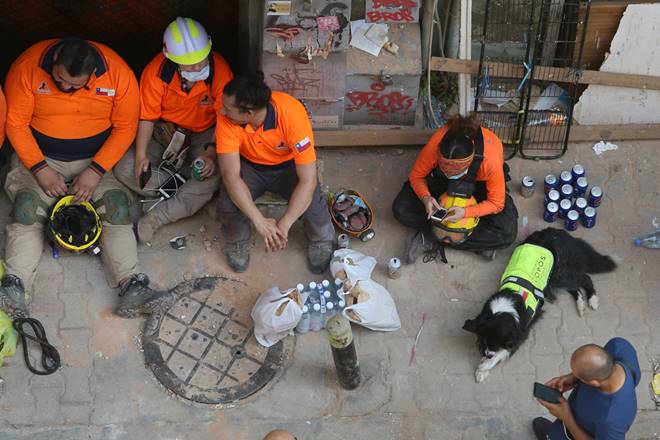 The Chilean rescue team sits together, with their dog Flash, as they take a break from checking buildings that collapsed from last month's port blast in Gemmayze, Beirut, Lebanon September 4, 2020. REUTERS/Aziz Taher The Chilean rescue team sits together, with their dog Flash, as they take a break from checking buildings that collapsed from last month's port blast in Gemmayze, Beirut, Lebanon September 4, 2020. REUTERS/Aziz Taher