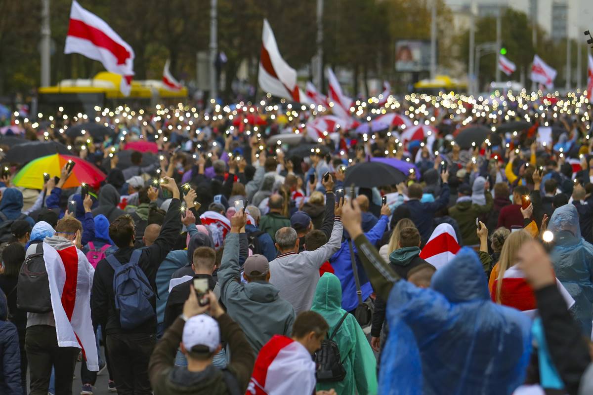 Demonstrators light their cell phones during an opposition rally to protest the official presidential election results in Minsk, Belarus (AP Photo) Demonstrators light their cell phones during an opposition rally to protest the official presidential election results in Minsk, Belarus (AP Photo)