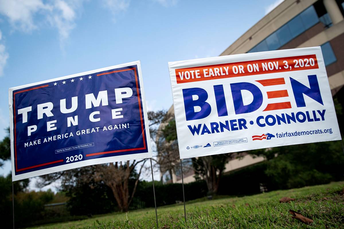 Yard signs supporting U.S. President Donald Trump and Democratic U.S. presidential nominee and former Vice President Joe Biden are seen outside of an early voting site at the Fairfax County Government Center in Fairfax, Virginia, U.S.. (Courtesy: Reuters/File Photo) Yard signs supporting U.S. President Donald Trump and Democratic U.S. presidential nominee and former Vice President Joe Biden are seen outside of an early voting site at the Fairfax County Government Center in Fairfax, Virginia, U.S.. (Courtesy: Reuters/File Photo)