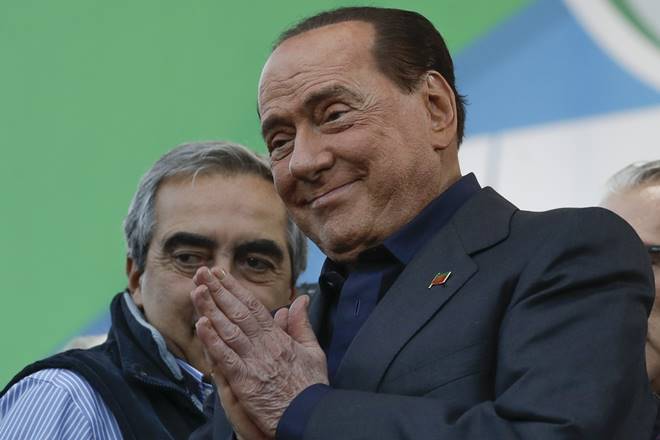 FILE - In this Oct. 19, 2019 file photo, Silvio Berlusconi addresses a rally in Rome. Italy’s former prime minister and right-wing leader Silvio Berlusconi has tested positive to coronavirus after a precautionary check, his press office said on Wednesday, Sept. 2, 2020. The three-time-premier and media tycoon had been recently seen with his old-time friend and businessman Flavio Briatore, who was recently hospitalized after testing positive to Covid-19 last month. Berlusconi had tested negative at the time. (AP Photo/Andrew Medichini) FILE - In this Oct. 19, 2019 file photo, Silvio Berlusconi addresses a rally in Rome. Italy’s former prime minister and right-wing leader Silvio Berlusconi has tested positive to coronavirus after a precautionary check, his press office said on Wednesday, Sept. 2, 2020. The three-time-premier and media tycoon had been recently seen with his old-time friend and businessman Flavio Briatore, who was recently hospitalized after testing positive to Covid-19 last month. Berlusconi had tested negative at the time. (AP Photo/Andrew Medichini)