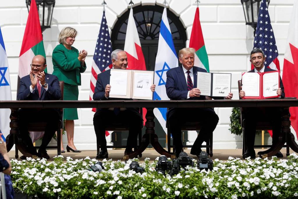 Bahrain’s Foreign Minister Abdullatif Al Zayani, Israel's Prime Minister Benjamin Netanyahu, U.S. President Donald Trump and United Arab Emirates (UAE) Foreign Minister Abdullah bin Zayed participate in the signing of the Abraham Accords, normalizing relations between Israel and some of its Middle East neighbors in a strategic realignment of Middle Eastern countries against Iran, on the South Lawn of the White House in Washington, U.S. (Courtesy: Reuters photo) Bahrain’s Foreign Minister Abdullatif Al Zayani, Israel's Prime Minister Benjamin Netanyahu, U.S. President Donald Trump and United Arab Emirates (UAE) Foreign Minister Abdullah bin Zayed participate in the signing of the Abraham Accords, normalizing relations between Israel and some of its Middle East neighbors in a strategic realignment of Middle Eastern countries against Iran, on the South Lawn of the White House in Washington, U.S. (Courtesy: Reuters photo)