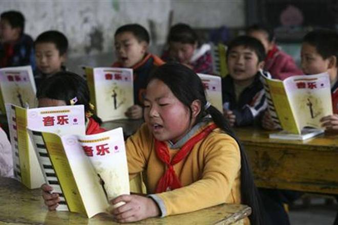 Reports said students had their temperatures checked on arrival but rules on social distancing and mask wearing varied depending on the region. Image: Reuters Reports said students had their temperatures checked on arrival but rules on social distancing and mask wearing varied depending on the region. Image: Reuters