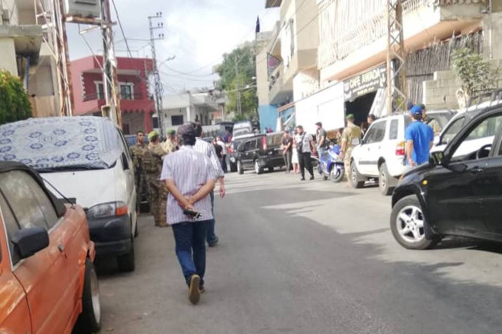 People and members of the Lebanese army gather near the site of an explosion in the village of Ain Qana in southern Lebanon. (Courtesy: Reuters photo)
