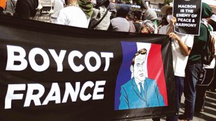 Protesters hold a banner depicting French President Emmanuel Macron during a protest against Macron's comments considered insulting Muslims, in Yogyakarta, Indonesia (REUTERS Image)