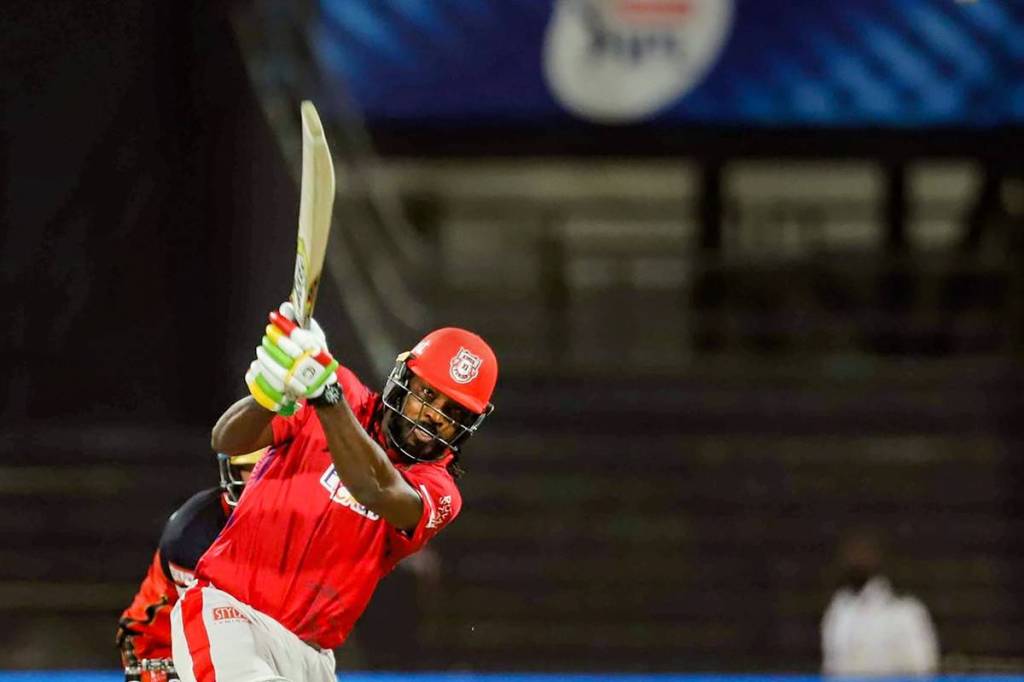 Kings XI Punjab batsman Chris Gayle plays a shot during the Indian Premier League (IPL) cricket match against Royal Challengers Bangalore, at Sharjah Cricket Stadium, in Sharjah. (FILE/PTI Photo/Sportzpics)