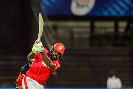 Kings XI Punjab batsman Chris Gayle plays a shot during the Indian Premier League (IPL) cricket match against Royal Challengers Bangalore, at Sharjah Cricket Stadium, in Sharjah. (FILE/PTI Photo/Sportzpics)