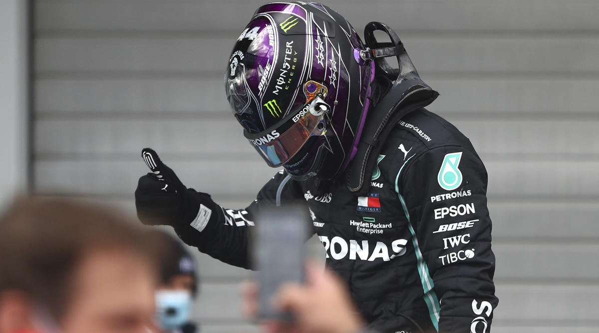 Schumacher's son Mick presented Hamilton with one of his father's old helmets after the British driver took a record-equaling 91st win at the Eifel Grand Prix. Schumacher's son Mick presented Hamilton with one of his father's old helmets after the British driver took a record-equaling 91st win at the Eifel Grand Prix.