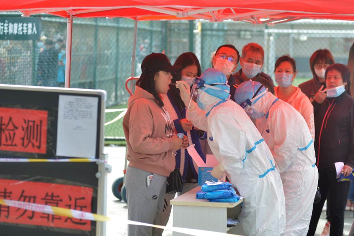 The source of the outbreak was traced to two dock workers who had tested positive for the virus in September but did not exhibit any symptoms at first. (Photo source: Reuters)