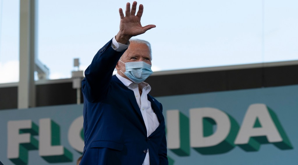 "Once we have a safe and effective vaccine, it has to be free to everyone, whether or not you're insured," the former vice president said. (Photo source: Reuters)