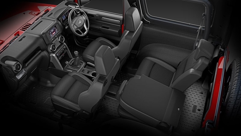 The new Thar has had its cabin completely redone with now more plush seats with improved height & lumbar support and a 50:50 split setup for the rear seats. The upholstery is washable. It gets roof-mounted speakers and a seven-inch touchscreen infotainment system with weather-resistant buttons. The system includes a first-in-class 'adventure stats' with details like G-monitor, compass, wheel angle, torque, etc. The instrument cluster is also all-new with a TFT colour display. The steering has mounted controls for audio and cruise control.