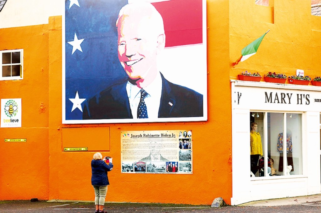 A woman takes a picture of a mural of US Presidential candidate Joe Biden in Ballina, west of Ireland. Ballina is the ancestral home of Joe Biden (AP photo) A woman takes a picture of a mural of US Presidential candidate Joe Biden in Ballina, west of Ireland. Ballina is the ancestral home of Joe Biden (AP photo)