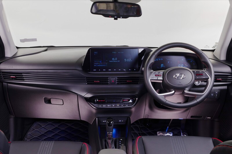 The cabin has been redesigned entirely and sports a unique look albeit inspired by many luxury cars. The AC Vents have been made to look like they are seamlessly integrated across the whole dashboard. The HVAC controls and the front of the centre console with the wireless charging pad have been angled towards the driver. The driver also gets a multifunction steering wheel and the design of the wheel itself is something we first saw on the Creta.