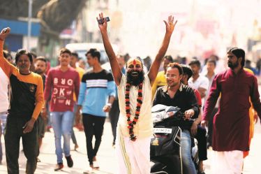 A man celebrates the Supreme Court verdict on the Ayodhya dispute in Ayodhya. (Express Photo)