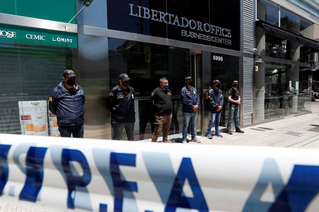 Police officers stand guard outside the building where Leopoldo Luque, the personal doctor of late Argentine soccer legend Diego Armando Maradona, has his office in Buenos Aires, Argentina. (Reuters image)