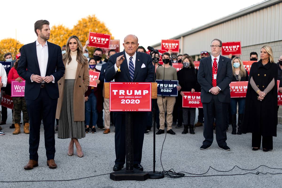 Former New York City Mayor Rudy Giuliani, personal attorney to U.S. President Donald Trump, speaks near Eric Trump and his wife Lara Trump, Trump campaign ballot counting observer Jeremy Mercer, and former Florida Attorney General Pam Bondi during a news conference held to discuss election-related lawsuits at Atlantic Aviation PHL private air terminal in Philadelphia, Pennsylvania, U.S. (Reuters image) Former New York City Mayor Rudy Giuliani, personal attorney to U.S. President Donald Trump, speaks near Eric Trump and his wife Lara Trump, Trump campaign ballot counting observer Jeremy Mercer, and former Florida Attorney General Pam Bondi during a news conference held to discuss election-related lawsuits at Atlantic Aviation PHL private air terminal in Philadelphia, Pennsylvania, U.S. (Reuters image)
