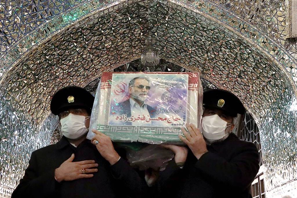 Servants of the holy shrine of Imam Reza carry the coffin of Iranian nuclear scientist Mohsen Fakhrizadeh, in Mashhad, Iran. Massoud Nozari/WANA (Reuters image)
