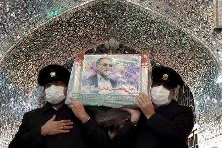 Servants of the holy shrine of Imam Reza carry the coffin of Iranian nuclear scientist Mohsen Fakhrizadeh, in Mashhad, Iran. Massoud Nozari/WANA (Reuters image)