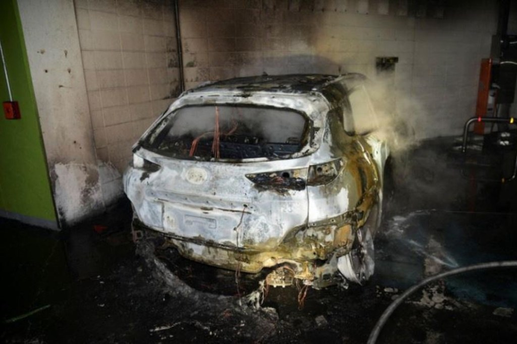 The burnt wreckage of a Hyundai Kona Electric vehicle is seen after it caught fire in Daegu, South Korea, 4 October 2020. Daegu Fire & Safety Department/Handout via Reuters